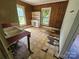 Open kitchen features wood paneling and a built-in cabinet at 562 W Wilson Ave, Mooresville, NC 28115