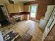 Open kitchen features wood paneling and light colored cabinets at 562 W Wilson Ave, Mooresville, NC 28115
