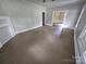 Living room featuring a fireplace, hardwood floors, and natural light at 562 W Wilson Ave, Mooresville, NC 28115