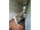 Staircase with wooden railing and steps leading to the lower level at 562 W Wilson Ave, Mooresville, NC 28115