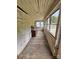 Sunroom with lots of windows, wood ceiling and floor, and a small dresser at 562 W Wilson Ave, Mooresville, NC 28115