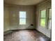 Corner bedroom with two windows offering natural light and hardwood flooring at 562 W Wilson Ave, Mooresville, NC 28115
