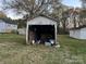 Exterior shot of garage with open door, revealing contents at 562 W Wilson Ave, Mooresville, NC 28115