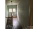 Hallway has stairs, hardwood floors and window that provides natural light at 562 W Wilson Ave, Mooresville, NC 28115