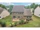 Aerial view of the home's back exterior, showcasing the patio and well-maintained yard at 5812 Dinsmore Ln, Belmont, NC 28012