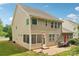 Back exterior of the two-story home featuring a patio, screened in porch, and basketball hoop at 5812 Dinsmore Ln, Belmont, NC 28012