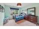 Cozy bedroom with colorful decor, a window view, and charming furnishings create a fun and inviting space at 5812 Dinsmore Ln, Belmont, NC 28012