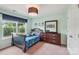 A bedroom offers colorful decorations, a window view, and cozy furnishings to create a fun, inviting space at 5812 Dinsmore Ln, Belmont, NC 28012