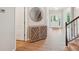 Elegant foyer with wood floors, decorative mirror, and staircase leading to the upper level at 5812 Dinsmore Ln, Belmont, NC 28012