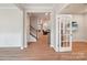 Inviting foyer leading to staircase, dining area, and living room with hardwood floors at 5812 Dinsmore Ln, Belmont, NC 28012