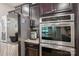 Modern kitchen featuring stainless steel appliances, including refrigerator and oven at 5812 Dinsmore Ln, Belmont, NC 28012