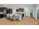 Spacious kitchen featuring granite countertops, a large island with seating, and stainless steel appliances at 5812 Dinsmore Ln, Belmont, NC 28012