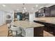 Open kitchen design with large granite island, seating, and stainless steel appliances at 5812 Dinsmore Ln, Belmont, NC 28012