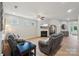 Cozy living room featuring a fireplace, hardwood floors, and a ceiling fan at 5812 Dinsmore Ln, Belmont, NC 28012