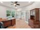 Bright office with hardwood floors, desk, cabinetry and large window with natural light at 5812 Dinsmore Ln, Belmont, NC 28012