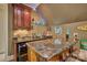 Basement bar with custom marble countertop and under counter refrigerator perfect for entertaining at 5826 Natoma Rd, Lake Wylie, SC 29710