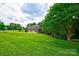 Spacious, two-story home with lush green lawn and mature shade trees on a large lot at 5826 Natoma Rd, Lake Wylie, SC 29710