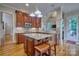 Well-equipped kitchen with custom cabinets, granite counters, stainless steel appliances, and bar seating at 5826 Natoma Rd, Lake Wylie, SC 29710