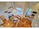 Overhead view of the living room featuring hardwood floors, large windows, and a fireplace at 5826 Natoma Rd, Lake Wylie, SC 29710