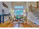 Bright living room with hardwood floors, high ceilings, large window and comfortable seating at 5826 Natoma Rd, Lake Wylie, SC 29710