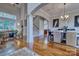 Spacious living and dining area with hardwood floors, staircase, and ample natural light at 5826 Natoma Rd, Lake Wylie, SC 29710