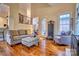 Inviting living room with hardwood floors, water feature, comfortable seating, and ample natural light at 5826 Natoma Rd, Lake Wylie, SC 29710