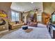 Spacious living room with neutral carpet, 2 windows, ceiling fan, and 2 sofas at 5826 Natoma Rd, Lake Wylie, SC 29710