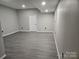 Spacious basement area with recessed lights and wood-look flooring provides a flexible living space at 7154 Woodcock Trl, Stanley, NC 28164
