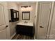 Elegant bathroom featuring a modern vanity and stylish fixtures at 7154 Woodcock Trl, Stanley, NC 28164
