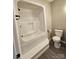 Standard bathroom with a tub-shower and toilet offers essential functionality at 7154 Woodcock Trl, Stanley, NC 28164