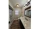 Updated bathroom featuring a glass enclosed shower, and modern dark fixtures at 7154 Woodcock Trl, Stanley, NC 28164