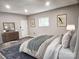 Relaxing bedroom with soft textures, decorative accents, and natural light creates a tranquil atmosphere at 7154 Woodcock Trl, Stanley, NC 28164