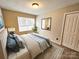 Serene bedroom featuring a comfortable bed, soft lighting, and a calming color scheme at 7154 Woodcock Trl, Stanley, NC 28164