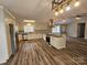Bright, open kitchen featuring stainless steel appliances and a breakfast bar at 7154 Woodcock Trl, Stanley, NC 28164