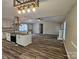 Open concept living area with a fireplace, flowing from a modern kitchen at 7154 Woodcock Trl, Stanley, NC 28164