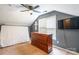 This bedroom features a dark accent wall, ceiling fan, natural light, and a wooden dresser at 7206 Stoney Place Ct, Charlotte, NC 28262