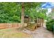 This backyard deck is located under a shady tree at 7206 Stoney Place Ct, Charlotte, NC 28262