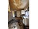 View of the kitchen space needing renovations, featuring a stainless steel sink at 722 S Weldon St, Gastonia, NC 28052
