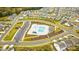 Aerial view of a neighborhood pool with a lap pool, lounge area, and ample parking for community residents and visitors at 7416 Hartsfield Dr, Lancaster, SC 29720
