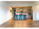 A kitchen features an island with bar seating and stainless steel appliances and wood flooring at 7416 Hartsfield Dr, Lancaster, SC 29720