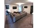 Spacious living room with a comfortable sectional sofa, entertainment center, and modern decor at 7416 Hartsfield Dr, Lancaster, SC 29720