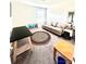 Cozy living room area features a plush sofa, soft carpet, and eye-catching decor for relaxed living at 7416 Hartsfield Dr, Lancaster, SC 29720