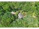 Aerial view of house surrounded by lush trees, showcasing a serene location at 8504 Knollwood Cir, Charlotte, NC 28213