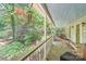 Covered back porch overlooking an extensive wooded backyard at 8504 Knollwood Cir, Charlotte, NC 28213