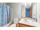 This bathroom features a single vanity with a mirror, toilet, and bathtub with shower at 8504 Knollwood Cir, Charlotte, NC 28213