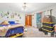 Bedroom with carpet, wood doors, closet, and a door leading to a balcony at 8504 Knollwood Cir, Charlotte, NC 28213