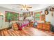 Bedroom featuring wood floors, windows, and a ceiling fan at 8504 Knollwood Cir, Charlotte, NC 28213