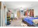 Bright bedroom featuring a large window, carpeted floors, and ample closet space at 8504 Knollwood Cir, Charlotte, NC 28213