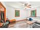 Bedroom with a ceiling fan and bright light from the two large windows at 8504 Knollwood Cir, Charlotte, NC 28213