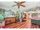 Large bedroom featuring wood floors, a ceiling fan, and natural light at 8504 Knollwood Cir, Charlotte, NC 28213